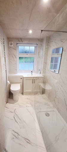 Full marble bathroom refit with bath and separate shower by Misbourne Plumbing